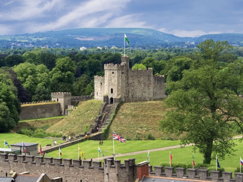 Cardiff Castle with hills and mountains in the background - copyright Brian Phillips & picfair.com