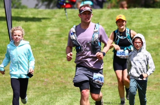 Mark Ford running with his children
