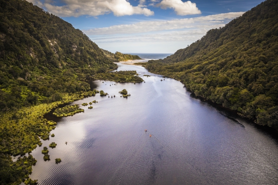 GODZone competitors packrafting Lake Herries  Kepler Mountains during Chapter 7 in 2018