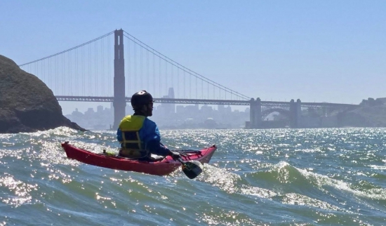 Greg Callas paddling towards the San Francisco Bay Bridge