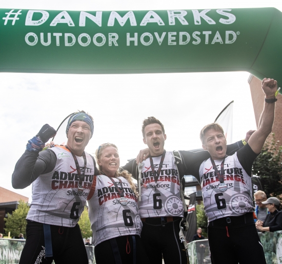 Team Racing Denmark Adventures celebrates their hard fought victory at the finish line in Silkeborg