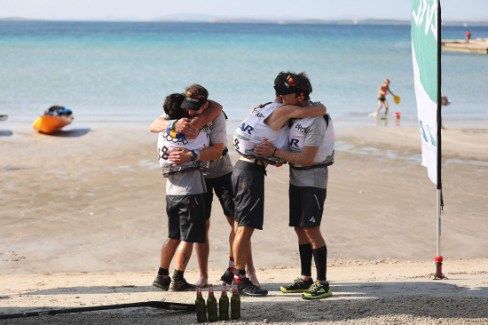 Team USWE on the finish line on the beach