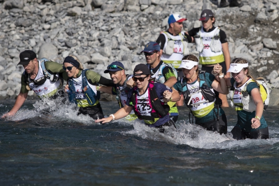 Competitors cross the Otira River