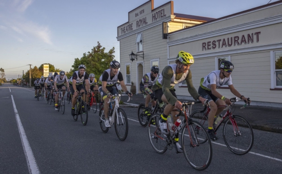 Cyclists ride through the West Coast settlement, Kumara in the Kathmandu Coast to Coast race